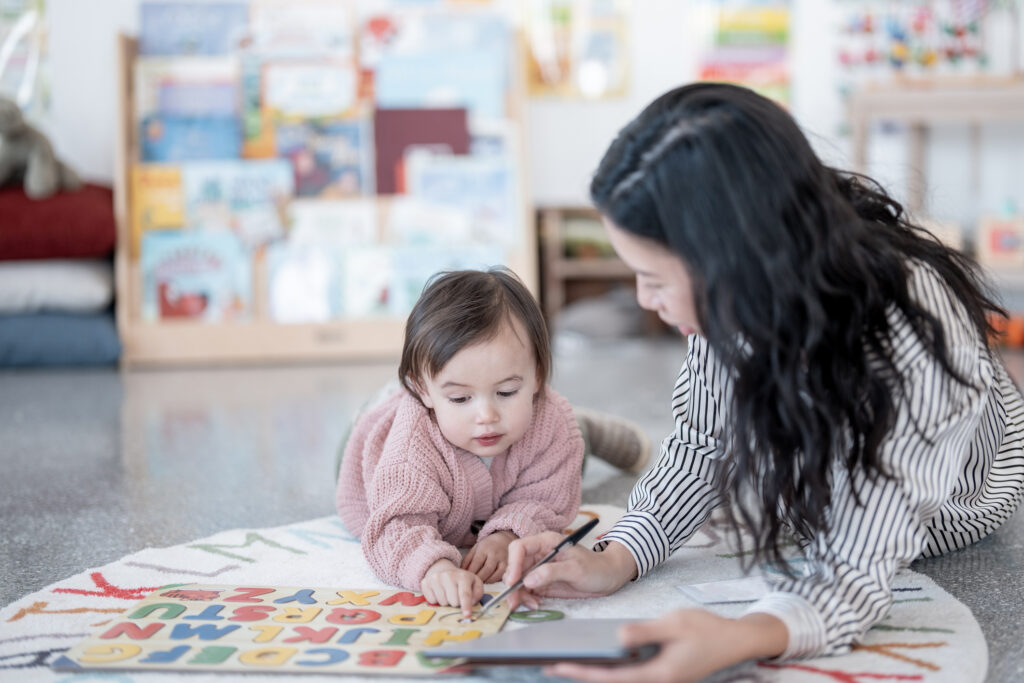 Child and adult engaged in learning